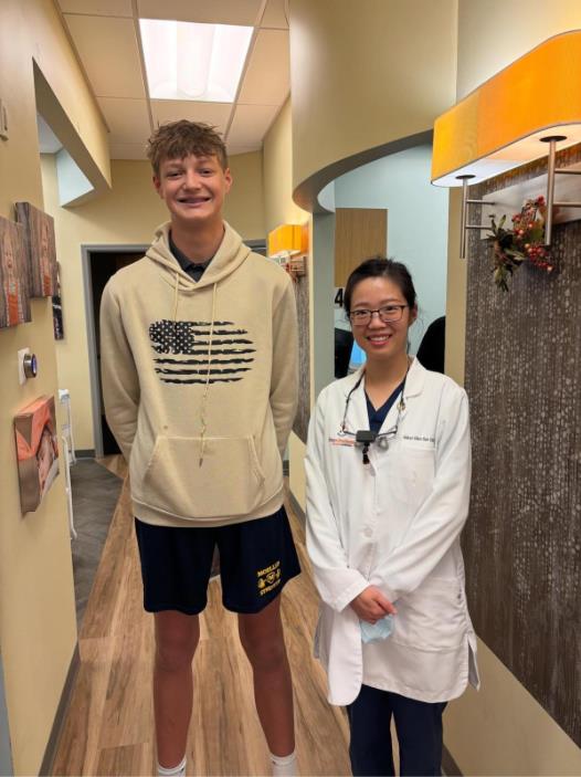 Boy and doctor smiling